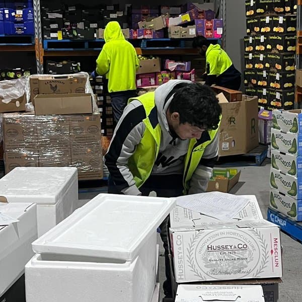 GFS Workforce team member picking orders in a warehouse